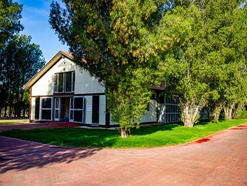 Stable building in lush green grounds