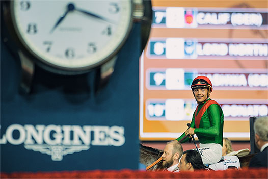 Jockey at race timing with Longines clock